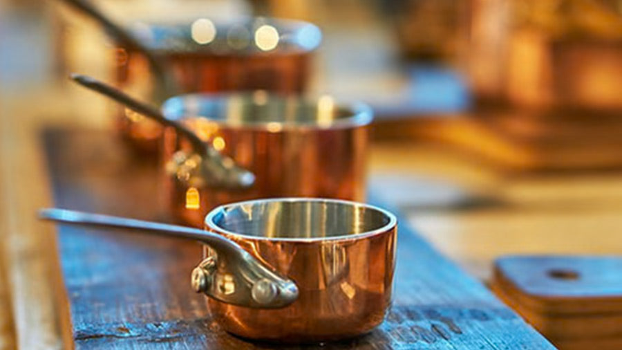 Different Size Copper Saucepans