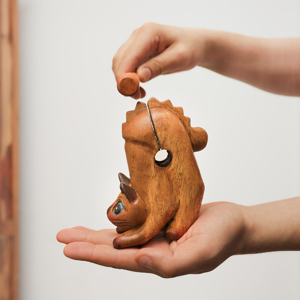 Handheld solid wood purring cat guiro whistle, handmade in Thailand, brown and cute ornamental design.