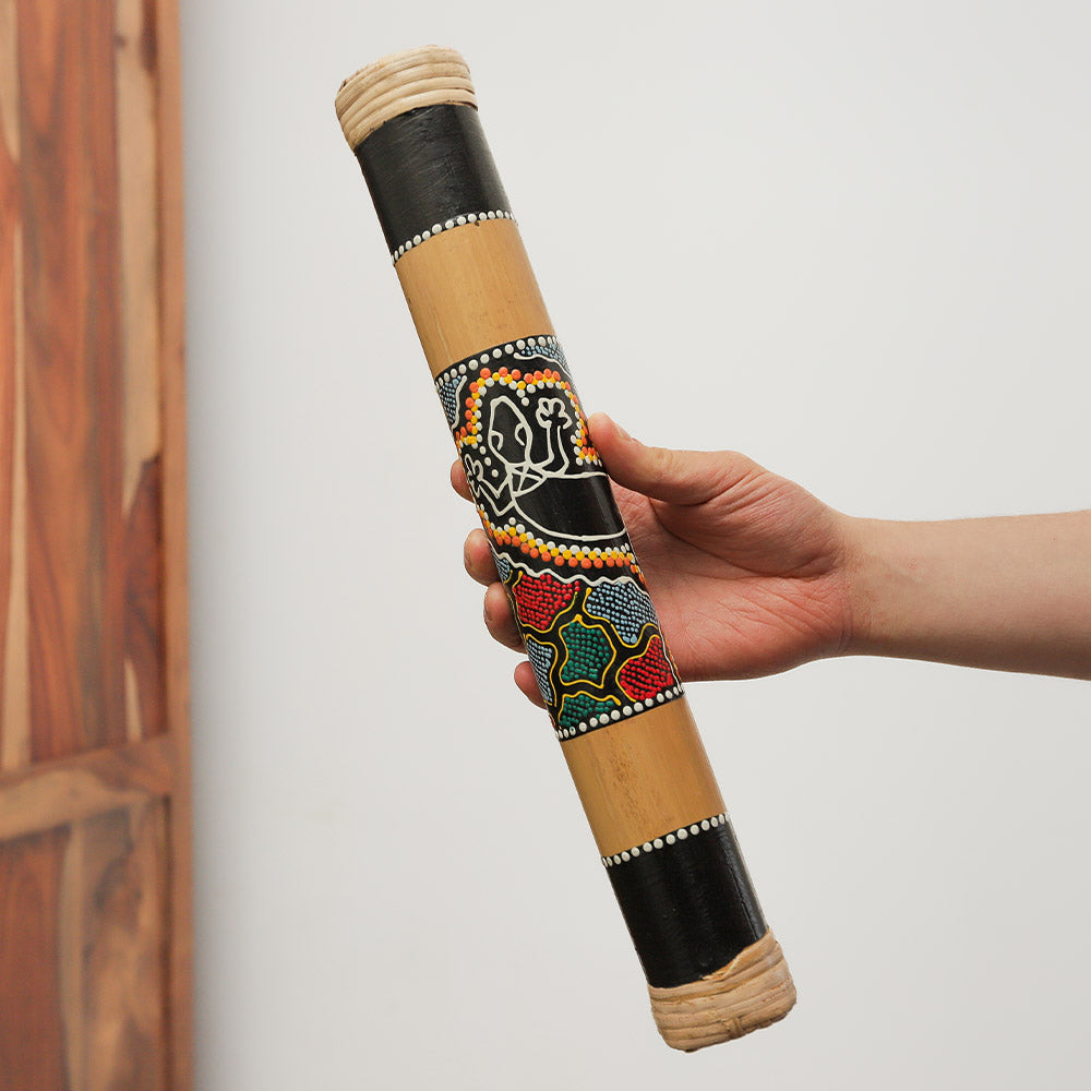 40cm Indonesian bamboo rainstick with dot-painted design, creating soothing rain sounds. Solid rain maker for music and relaxation