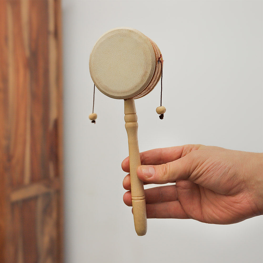 Kolaka Monkey drum held in hand to show its scale.