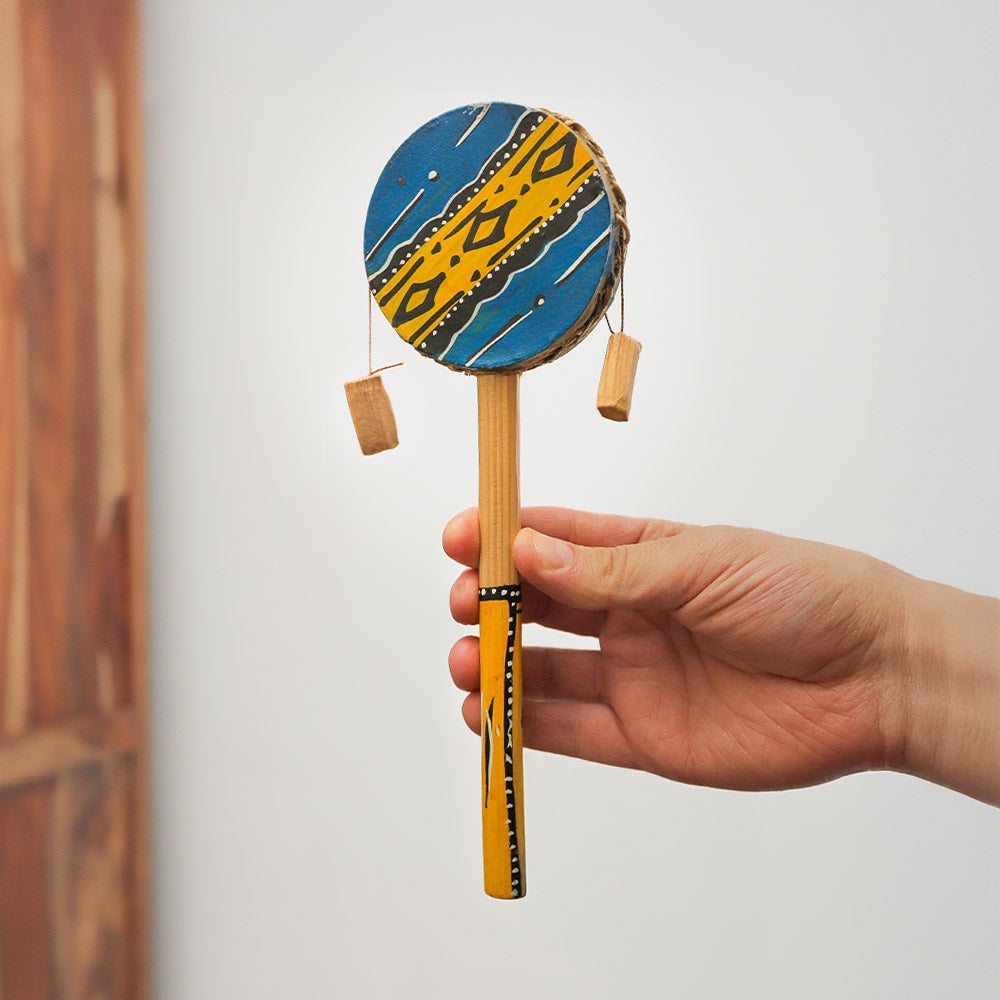 Hand-painted Nakuru monkey twist drum in blue and yellow, a handheld African percussion instrument that creates rhythmic sounds when twisted.
