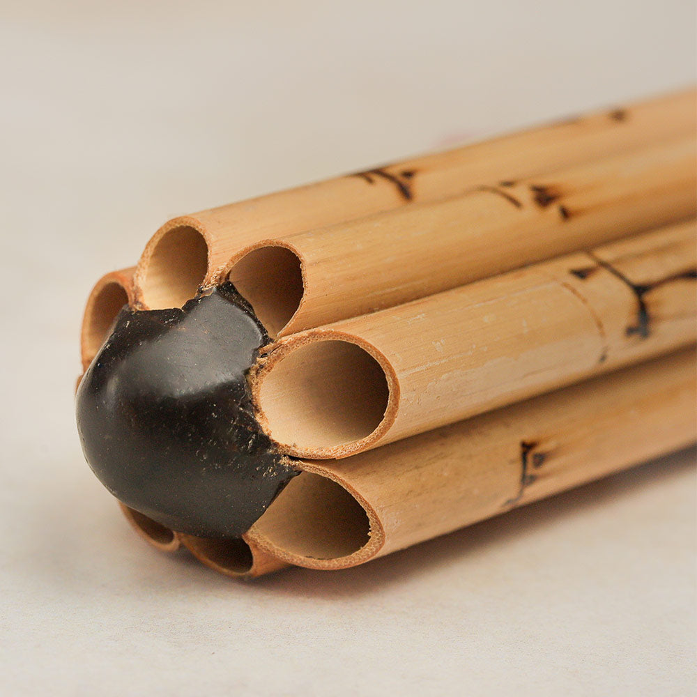 Close-up of the Thai Wot bamboo flute, highlighting its detailed structure.