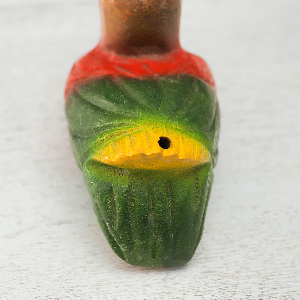  Close-up of the bum hole (whistle-blowing part) of a wooden sitting duck whistle.