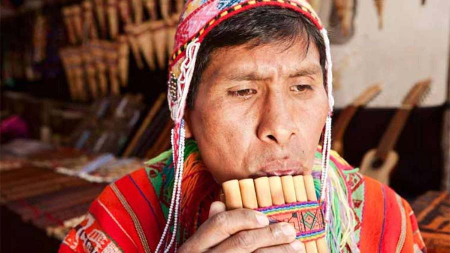 Man playing the Peruvian panpipes